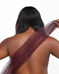 Glow Up body care bundle displayed on a model showcasing healthy skin for radiant beauty