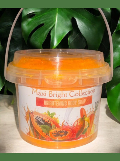Maxi Bright Collection Brightening Body Soap in a clear bucket with vibrant orange color and tropical fruit illustrations